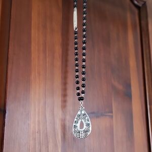 Silver and Black Beaded Pendant Necklace With Intricate Design